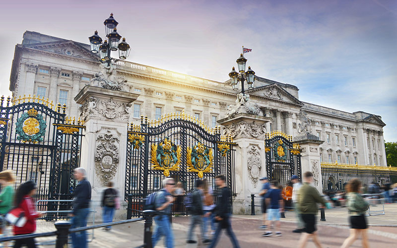 Tourists walking near Buckingham Palace in London