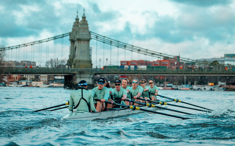 People participating in a boat race during a festival in the UK, April