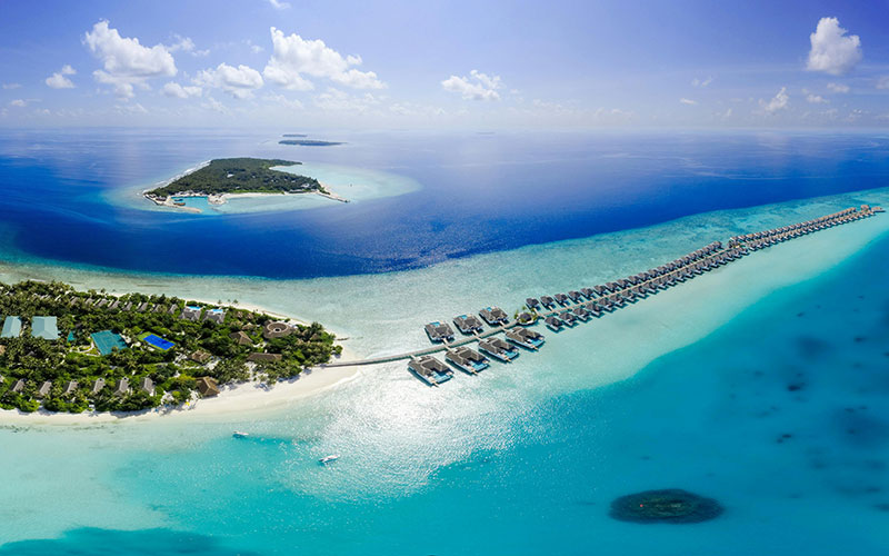 Scenic view of the Maldives with turquoise waters and overwater bungalows