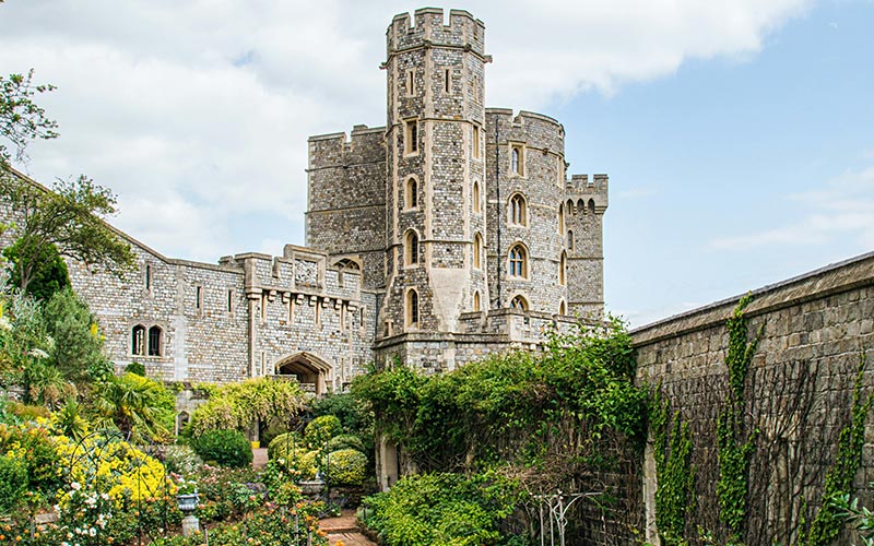 View of Windsor Castle in the UK during May, with greenery and clear skies