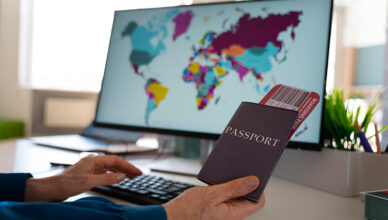 Side view of a man holding passports, related to UK visa tracking.